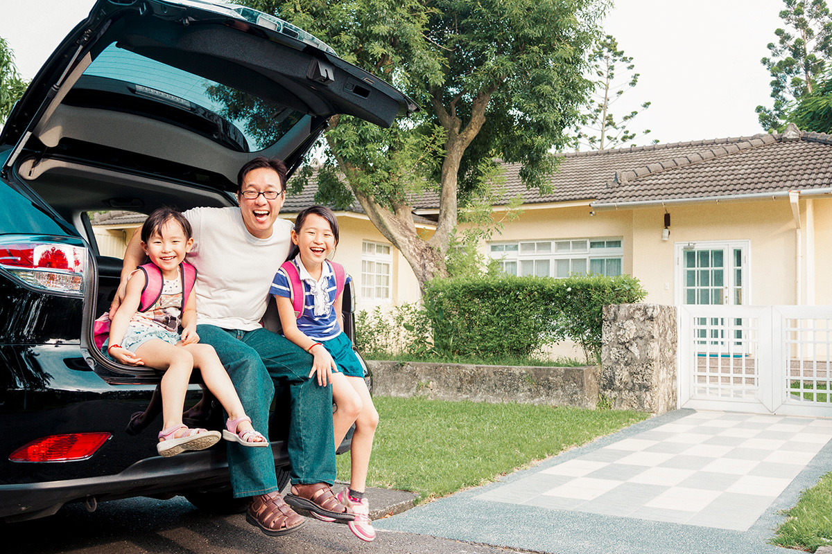 Family sitting in car